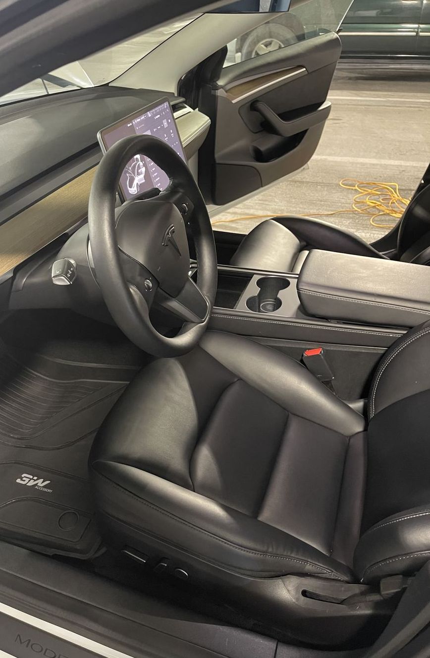 Tesla Model 3 driver floor after detailing